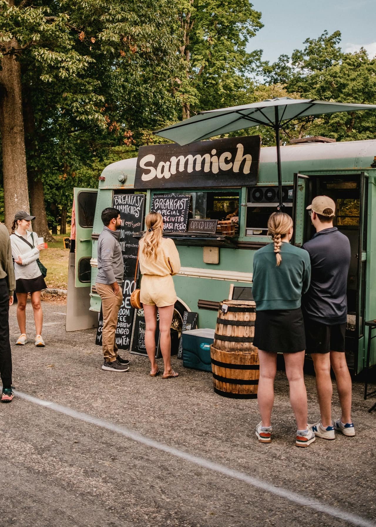 Customers gathered at a food truck at sunset